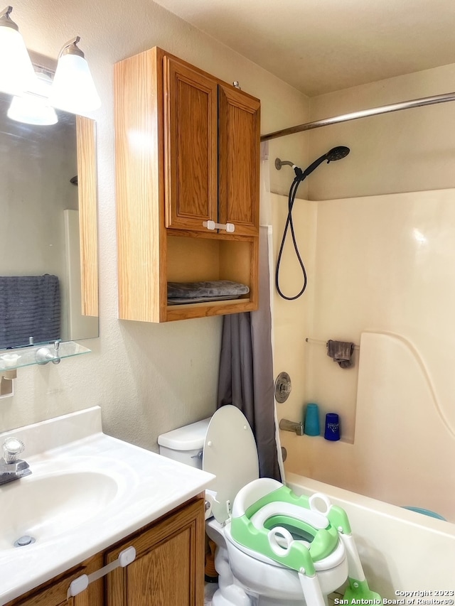 full bathroom with shower / bath combination with curtain, toilet, and vanity