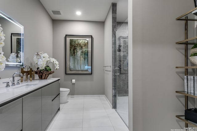 bathroom featuring toilet, tile flooring, walk in shower, and vanity