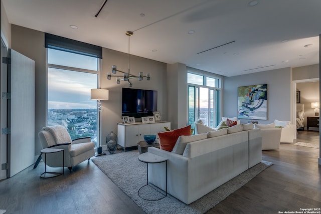 living room featuring floor to ceiling windows and hardwood / wood-style floors