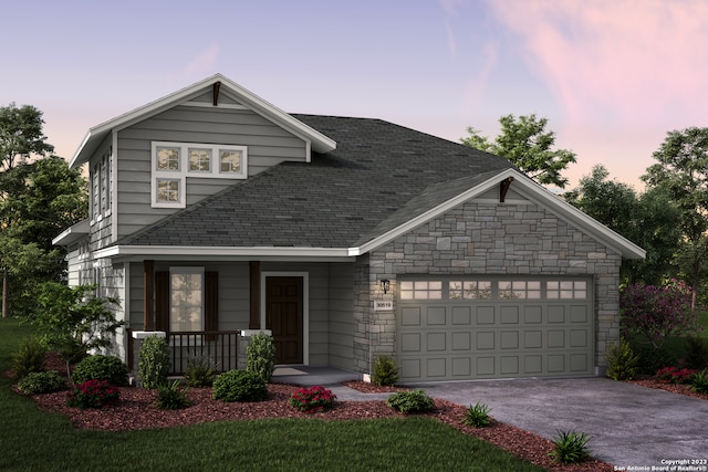 view of front facade featuring covered porch and a garage