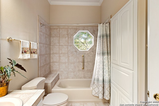 full bathroom featuring vanity, tile flooring, toilet, shower / bath combination with curtain, and crown molding