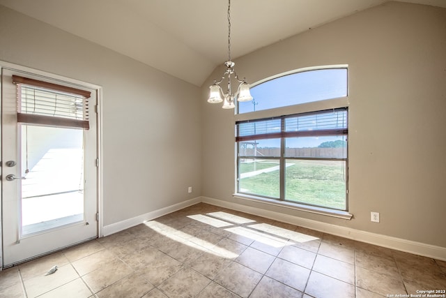 unfurnished room with light tile floors, a notable chandelier, and lofted ceiling