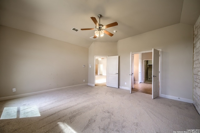 unfurnished bedroom with high vaulted ceiling, light colored carpet, and ceiling fan