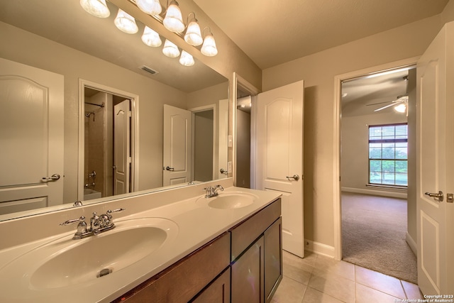 bathroom featuring ceiling fan, double sink vanity, and tile floors