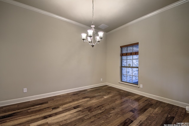 unfurnished room featuring dark hardwood / wood-style flooring, ornamental molding, and a chandelier