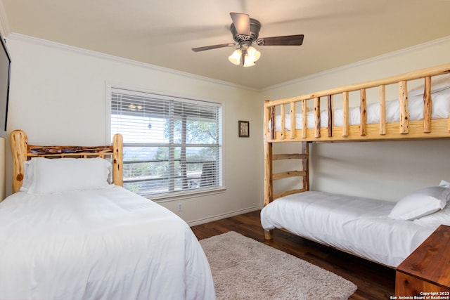 bedroom featuring ceiling fan, dark wood-type flooring, and ornamental molding