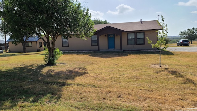 ranch-style house with a front yard