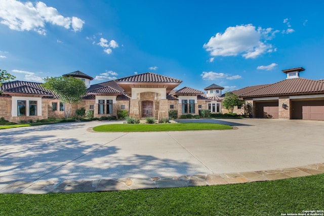 mediterranean / spanish-style home featuring a front lawn