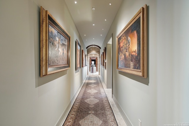 hallway featuring light tile floors