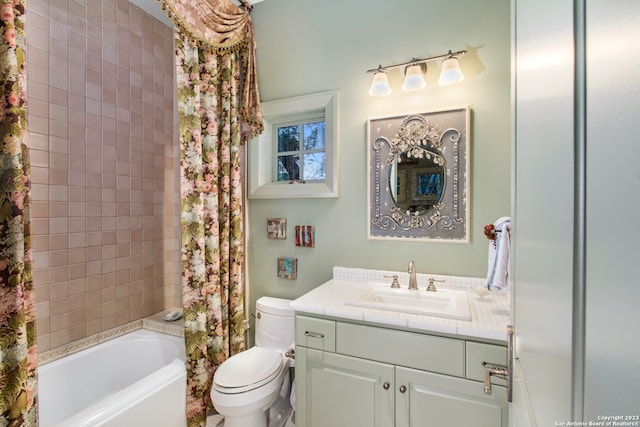 full bathroom with toilet, vanity, and shower / bath combo