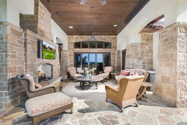 view of patio featuring an outdoor living space with a fireplace and french doors