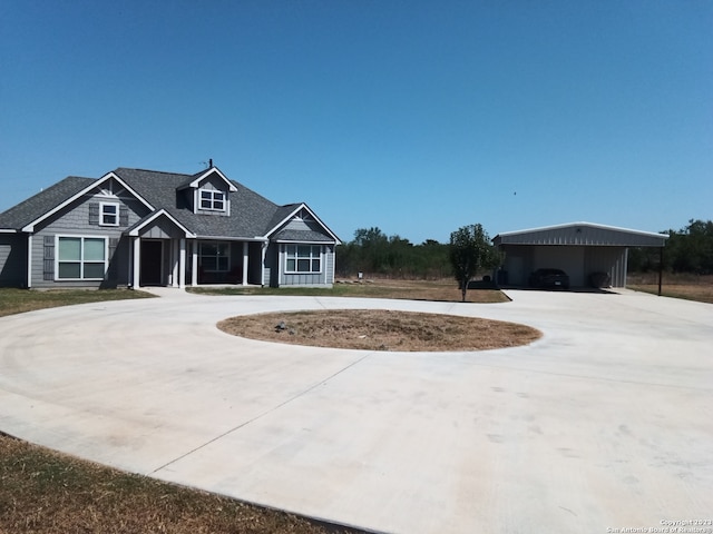 view of front of home featuring a carport and a garage