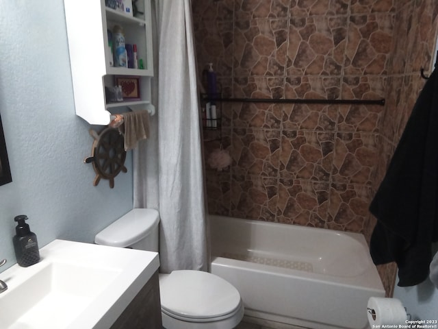 full bathroom with shower / bath combination with curtain, toilet, and vanity