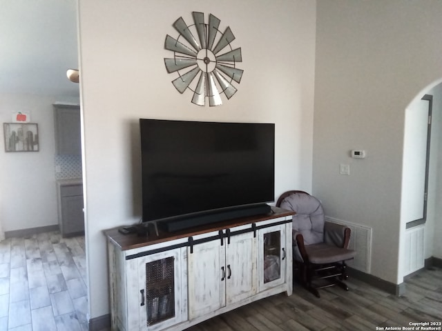 living room with dark hardwood / wood-style floors