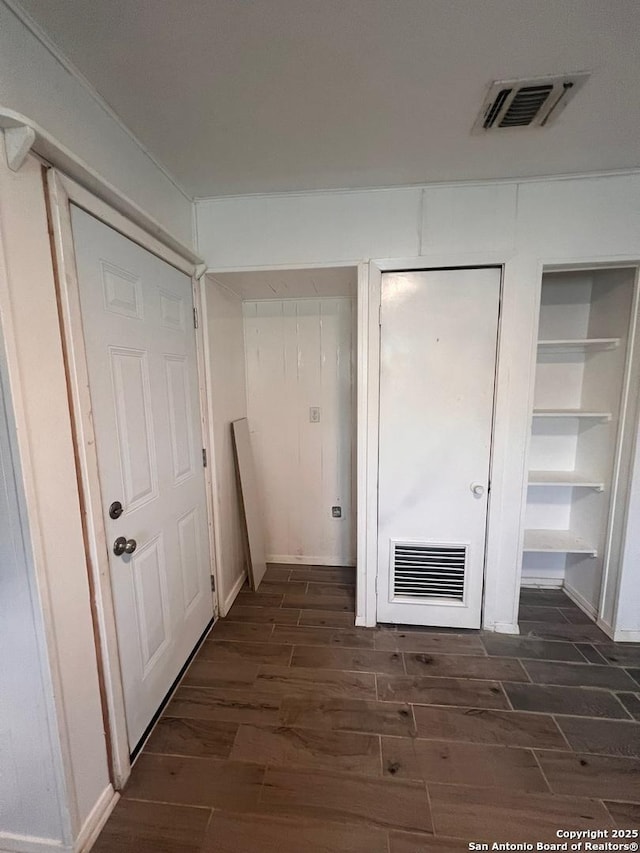 hall with dark hardwood / wood-style floors