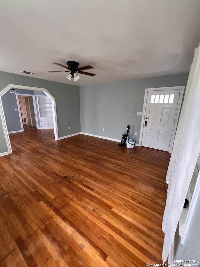 foyer entrance featuring wood-type flooring and ceiling fan