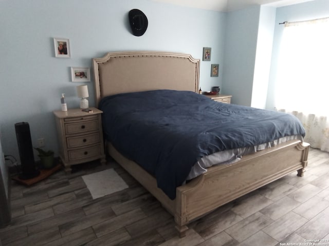 bedroom featuring dark hardwood / wood-style floors