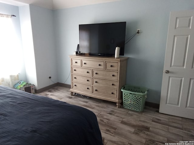 bedroom with light hardwood / wood-style flooring