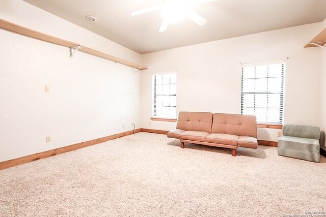 unfurnished room featuring light colored carpet and ceiling fan