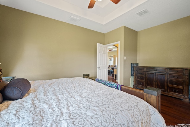 bedroom featuring ceiling fan and dark wood-type flooring