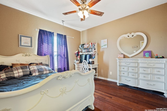 bedroom with ceiling fan and dark wood-type flooring