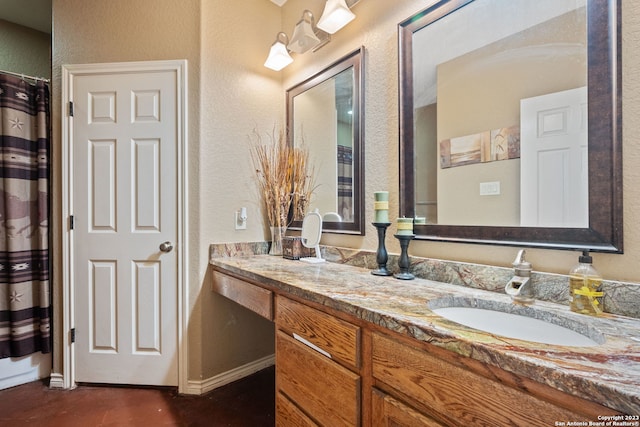 bathroom featuring dual bowl vanity