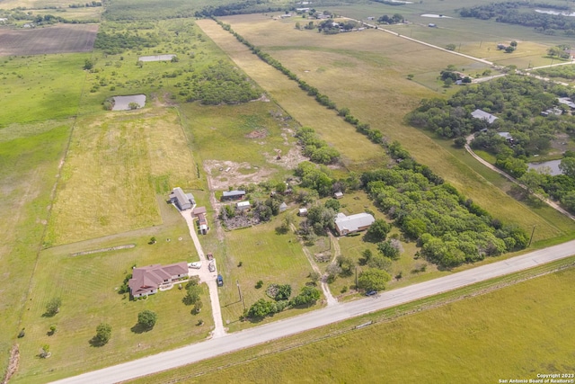 birds eye view of property with a rural view