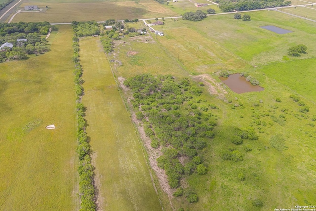 birds eye view of property with a rural view and a water view