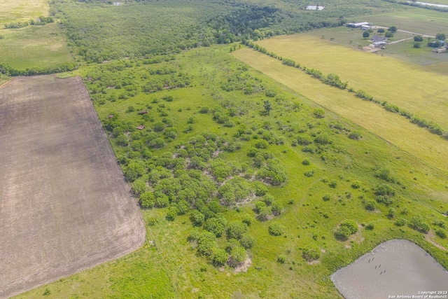 birds eye view of property featuring a rural view