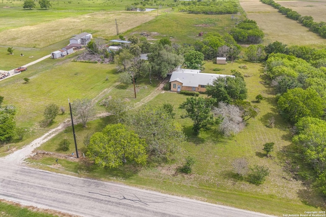 birds eye view of property featuring a rural view