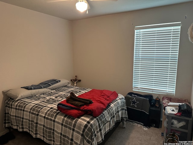 carpeted bedroom featuring ceiling fan