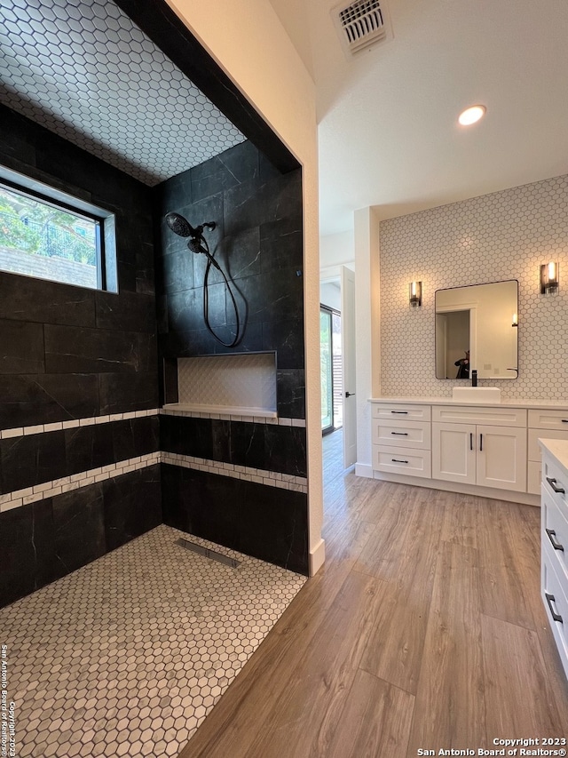 bathroom with hardwood / wood-style flooring and vanity