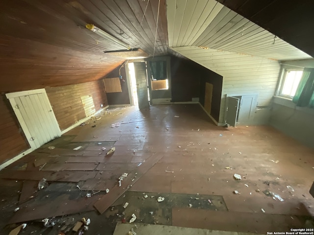 additional living space featuring vaulted ceiling and wooden ceiling