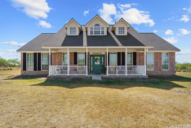 view of front of house with a front lawn and a porch