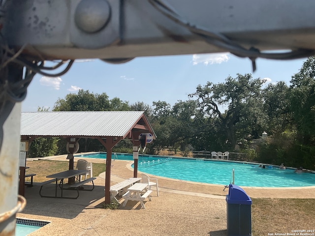 view of swimming pool featuring a patio