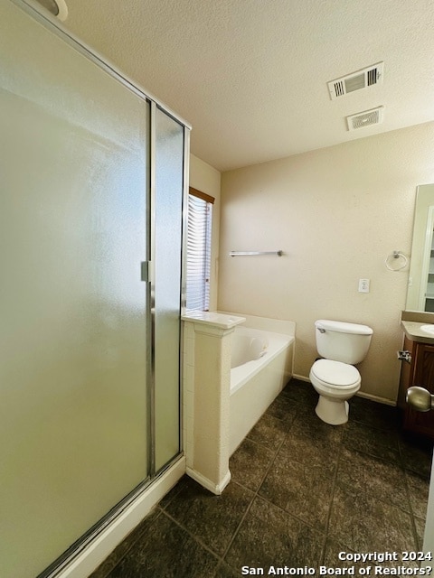 full bathroom featuring vanity, a textured ceiling, tile floors, and independent shower and bath