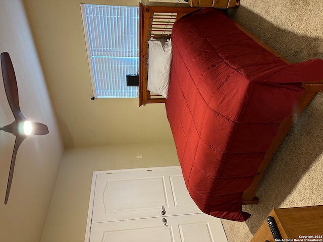 bedroom featuring light colored carpet