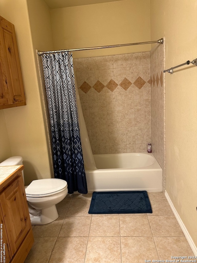 full bathroom with toilet, vanity, shower / tub combo with curtain, and tile flooring