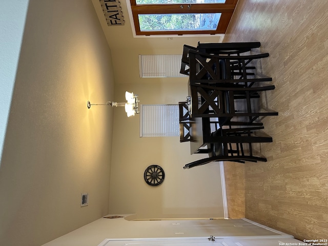 dining area featuring wooden walls