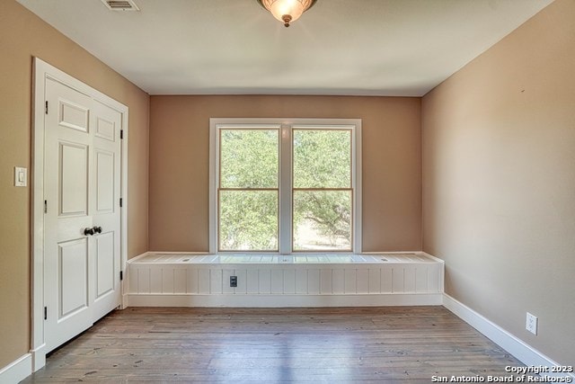 unfurnished room with light hardwood / wood-style floors