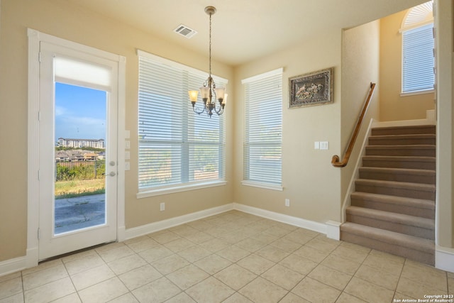 unfurnished dining area featuring light tile floors and a notable chandelier