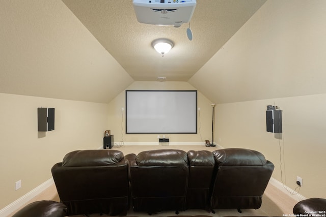 home theater with light carpet, a textured ceiling, and lofted ceiling