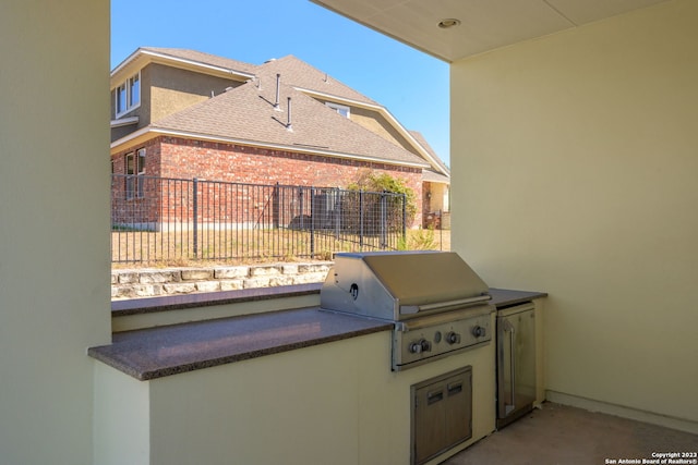 view of patio / terrace featuring grilling area and an outdoor kitchen