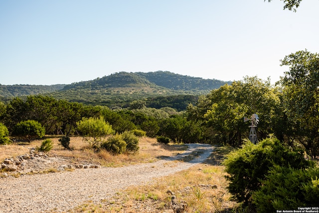 mountain view featuring a rural view