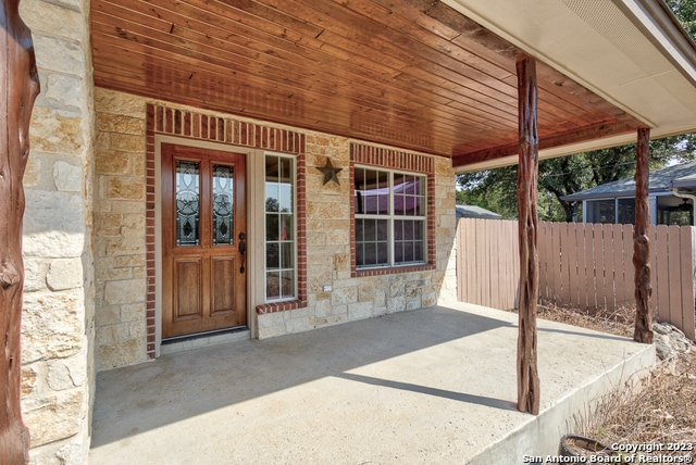 property entrance with a patio