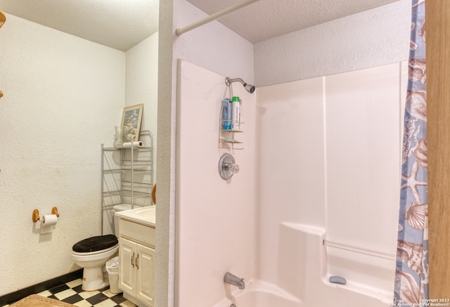 full bathroom with toilet, vanity, a textured ceiling, shower / bathtub combination with curtain, and tile floors