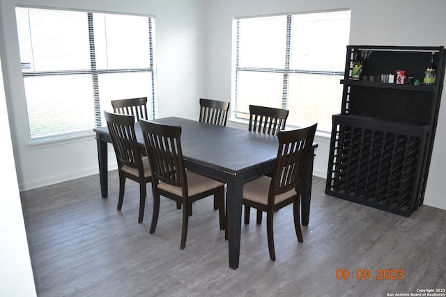 dining area with dark hardwood / wood-style flooring