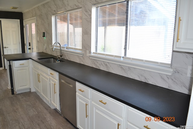 kitchen with sink, white cabinets, dishwasher, and dark hardwood / wood-style flooring