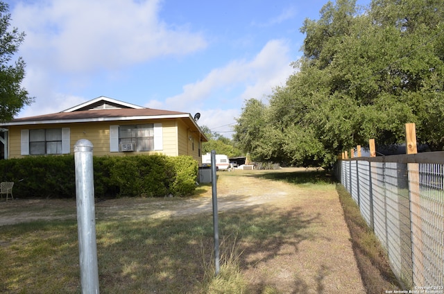 view of home's exterior with a lawn