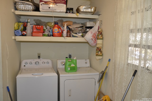 laundry room with washing machine and dryer